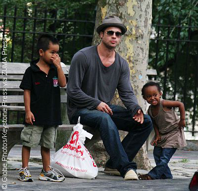 Brad Pitt with two of his kids at park